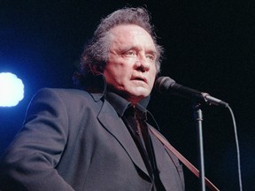 This file photo taken April 16, 1997 in Bourges, France, shows U.S. country singer Johnny Cash performing during the Printemps de Bourges Festival.