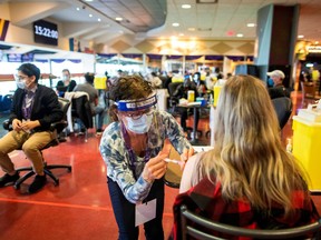 A health-care worker administers the Pfizer/BioNTech coronavirus disease (COVID-19) vaccine, which was authorized by Canada to be used for children aged 12 to 15, at Woodbine Racetrack pop-up vaccine clinic in Toronto May 5, 2021.