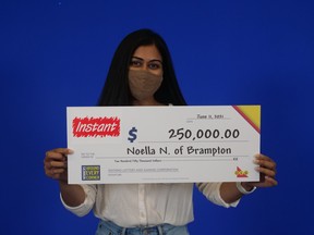 Noella Noronha with her big cheque.