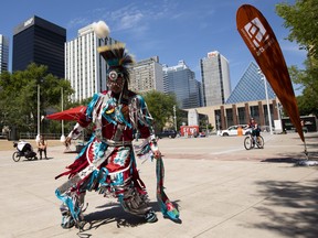 mitêw kisêynô performs a grass dance at Churchill Square as part of National Indigenous Peoples Day  on Monday, June 21, 2021 in Edmonton.