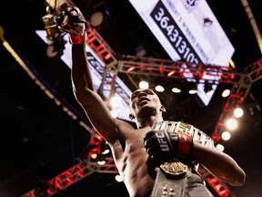 Israel Adesanya of Nigeria exits the octagon after defeating Marvin Vettori of Italy by unanimous decision to win the middleweight championship during UFC 263 at Gila River Arena on June 12, 2021 in Glendale, Ariz.