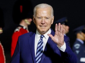 U.S. President Joe Biden waves upon arrival at Cornwall Airport Newquay, near Newquay, Cornwall, Britain, Wednesday, June 9, 2021.