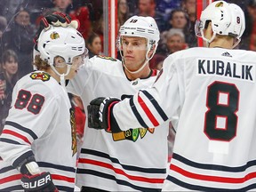 A low key celebration for the first Chicago goal by (from left) Patrick Kane, Jonathan Toews and Dominik Kubalik during the second period as the Ottawa Senators take on the Chicago Black Hawks in NHL action at the Canadian Tire Centre in Ottawa, Jan. 14, 2020.