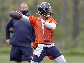 Chicago Bears quarterback Justin Fields (1) works out during rookie minicamp at Halas Hall.