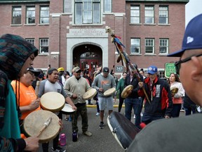 Drummers gather on the grounds of the former Kamloops Indian Residential School, after the remains of 215 children, some as young as three years old, were found at the site in Kamloops, B.C., Saturday, June 5, 2021.