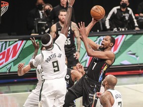 Brooklyn Nets forward Kevin Durant shoots over Milwaukee Bucks center Bobby Portis in the third quarter during Game 2 in the second round of the 2021 NBA Playoffs. at Barclays Center in Brooklyn, N.Y., June 7, 2021.