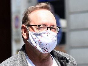 Actor Kevin Spacey walks down Carlo Alberto street as he visits the city, where he is expected to return for a cameo appearance in a low budget Italian film, after largely disappearing from public view, in Turin, Italy, June 1, 2021.