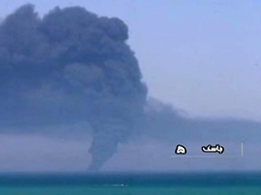 In this image grab taken from a broadcast by Islamic Republic of Iran Broadcasting (IRIB) on June 2, 2021 shows smoke billowing from  Iranian Kharg 431 supply navy ship in Gulf of Oman.