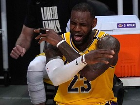 Los Angeles Lakers forward LeBron James reacts in the second half against the Phoenix Suns during Game 6 in the first round of the 2021 NBA Playoffs at Staples Center in Los Angeles, Calif., June 3, 2021.