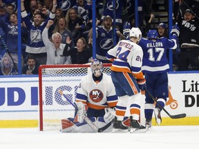 Tampa Bay Lightning left wing Alex Killorn celebrates as he scores a goal on New York Islanders goaltender Ilya Sorokin during the second period in Game 5  of the Stanley Cup semifinals at Amalie Arena in Tampa, Fla., June 21, 2021.