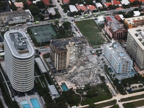 In this aerial view, search and rescue personnel work after the partial collapse of the 12-story Champlain Towers South condo building on June 24, 2021 in Surfside, Fla.