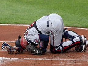 Catcher Mitch Garver of the Minnesota Twins stays on the ground after being injured and leaving the game in the first inning against the Baltimore Orioles at Oriole Park at Camden Yards on June 1, 2021 in Baltimore, Md.