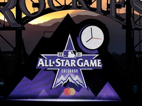 Logos for the 2021 MLB All-Star Game are on display during the fourth inning of the game between the Rockies and Reds at Coors Field in Denver, May 13, 2021.