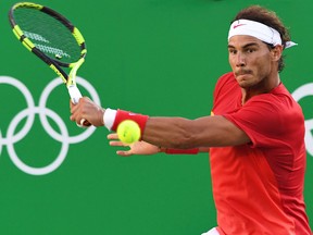 In this file photo taken on August 13, 2016 Spain's Rafael Nadal returns the ball to Argentina's Juan Martin Del Potro during their semifinal match at the Olympic Tennis Centre of the Rio 2016 Olympic Games in Rio de Janeiro.