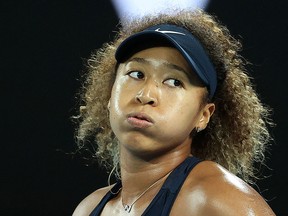 This file photo taken on February 20, 2021 shows Naomi Osaka reacting on a point against Jennifer Brady during the Australian Open in Melbourne.