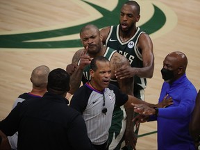 P.J. Tucker of the Milwaukee Bucks is held back by Khris Middleton during an altercation with Kevin Durant of the Brooklyn Nets in the second half of Game 3 of the Eastern Conference second round playoff series at the Fiserv Forum on June 10, 2021 in Milwaukee, Wis.