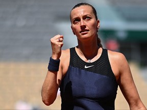 Czech Republic's Petra Kvitova celebrates after winning against Belgium's Greet Minnen during their women's singles first round tennis match on Day 1 of The Roland Garros 2021 French Open tennis tournament in Paris on May 30, 2021.