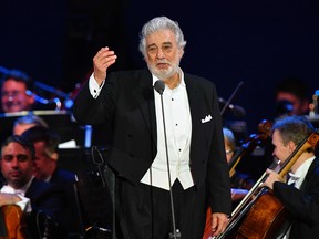 In this file photo taken on August 28, 2019 Spanish tenor Placido Domingo performs during his concert in the newly inaugurated sports and culture centre 'St Gellert Forum' in Szeged, Hungary.