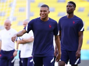 France's Kylian Mbappe and Paul Pogba take part in training at the Allianz Arena in Munich, Germany on June 14, 2021.