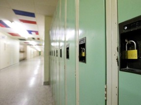 Lockers in an empty school hallway.