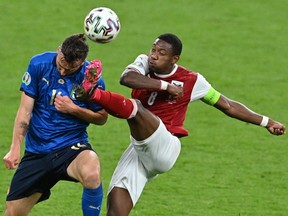 Italy's Bryan Cristante in action with Austria's David Alaba in a Euro 2020 match at Wembley Stadium in London on June 26, 2021.
