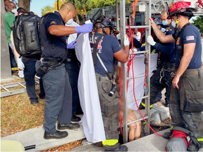 Delray Beach Fire Rescue pull Lyndsey Kennedy out of a storm drain in March.