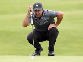 Richard Bland lines up his putt on the ninth green during the second round of the U.S. Open golf tournament at Torrey Pines Golf Course on June 18, 2021.