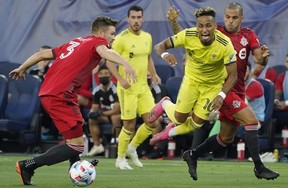 Defender Eriq Zavaleta (left) and Toronto FC takes on FC Cincinnati.