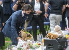 Prime Minister Justin Trudeau lays flowers at the London Mosque prior to a Tuesday a vigil being held in memory of the Afzaal-Salman family. Four members of the family were killed Sunday in what police allege was a hate-motivated attack.