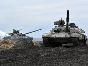 Tanks of the Ukrainian Armed Forces are seen during drills at an unknown location near the border of Russian-annexed Crimea, Ukraine, in this handout picture released by the General Staff of the Armed Forces of Ukraine press service April 14, 2021.   via