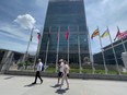 People walk past the United Nations headquarters on the East Side of Manhattan, in New York City, June 8, 2021.