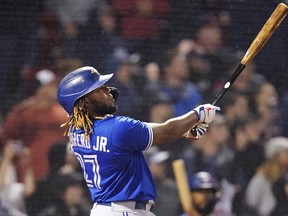 Blue Jays designated hitter Vladimir Guerrero Jr. watches his solo home run, tying the game at 1-1, in the top of the ninth inning against the Red Sox at Fenway Park in Boston on Monday, June 14, 2021.