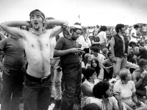 In this Aug. 16, 1969, file photo, rock music fans relax during a break in the entertainment at the Woodstock Music and Arts Fair in Bethel, N.Y.