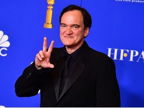 In this file photo taken on Jan. 5, 2020 director Quentin Tarantino poses in the press room after winning the award for Best Screenplay - Motion Picture and Best Motion Picture - Musical or Comedy during the 77th annual Golden Globe Awards at The Beverly Hilton hotel in Beverly Hills, California.