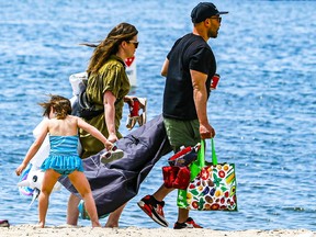 A family heads to Sunnyside Beach on Saturday, June 5, 2021.