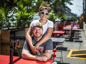 Sitting on the CafeTO patio, Shane Ryan and his wife Virginia McIntosh, owners of Breakwall BBQ along Queen St. E, just west of Woodbine Ave. on the in Toronto, Ont. on Thursday, June 10, 2021.