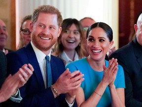 Britain's Prince Harry and his wife Meghan, Duchess of Sussex, cheer during the annual Endeavour Fund Awards at Mansion House in London, Britain March 5, 2020.