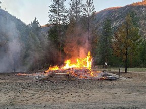 The burning remains of a church are shown in Chopaka, B.C. in a handout photo taken on Saturday, June 26, 2021.