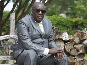 Dr. Jean Robert Ngola is seen in his yard, in Trois-Rivieres, Que., Friday, June 11, 2021.