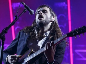 Guitarist Winston Marshall of Mumford  Sons performs at Rexall Place on their Gentlemen Of The Road 2015 tour in Edmonton, Alta., on Tuesday August 11, 2015.