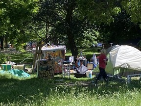 The homeless encampment at Trinity Bellwoods Park, one of many in downtown Toronto, now consists of more than 70 tents and assorted structures.