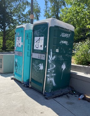 Some of the many port-a-potties placed at the homeless encampment in Trinity Bellwoods Park, one of many such encampments in downtown Toronto.