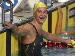 Australia's Madeline Groves reacts after setting a record time in her women's 100m butterfly semifinal at the Aquatic Centre during the 2018 Commonwealth Games on the Gold Coast, Australia, Thursday, April 5, 2018.