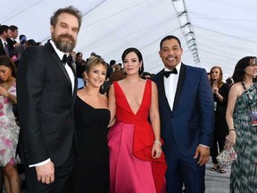 From left to right: Actor David Harbour, left, SAG-AFTRA president Gabrielle Carteris, singer Lily Allen and actor Jason George arrive for the 26th Annual Screen Actors Guild Awards at the Shrine Auditorium in Los Angeles on Jan. 19, 2020.