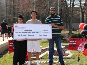 Joshua Nelson (centre), 18, recently earned a $43,000 President’s Scholarship from Southeast Missouri State University.