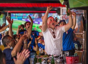 Rosario cheers as he watches Italy take on Turkey at EURO 2020 at Cafe Diplomatico Restaurant and Pizzaria, located at Clinton and College Sts. in Toronto, Ontario on Friday, June 11, 2021.