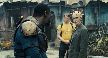IDRIS ELBA as Bloodsport, JOEL KINNAMAN as Colonel Rich Flag and PETER CAPALDI as Thinker in Warner Bros. Pictures’ superhero action adventure THE SUICIDE SQUAD.