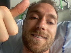 Danish footballer Christian Eriksen gives a thumbs-up at Rigshospitalet, where he is treated after he collapsed during a UEFA Euro 2020 game on Saturday, in Copenhagen, Denmark, in this picture obtained from social media.