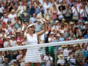 Tennis - Wimbledon - All England Lawn Tennis and Croquet Club, London, Britain - July 13, 2019  Romania's Simona Halep celebrates winning the final against Serena Williams of the U.S.