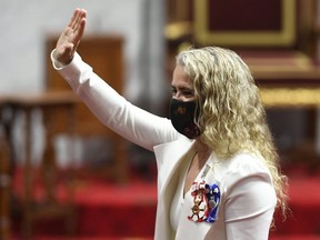 Former governor general Julie Payette gives a wave as she waits prior to delivering the throne speech in the Senate chamber in Ottawa on Wednesday, Sept. 23, 2020.